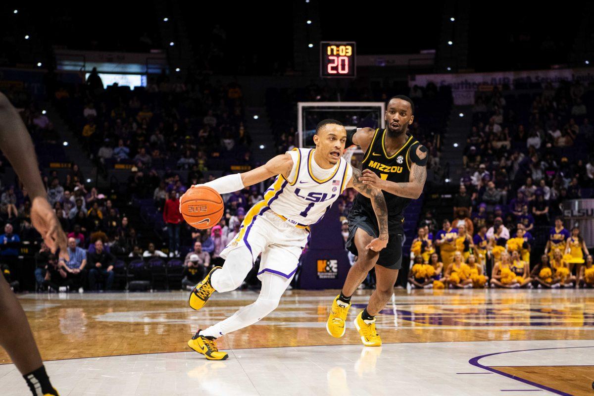 LSU men&#8217;s basketball senior guard Xavier Pinson (1) dribbles past a defender Saturday, Feb. 26, 2022, during LSU&#8217;s 75-55 win against Missouri in the Pete Maravich Assembly Center on North Stadium Drive in Baton Rouge, La.