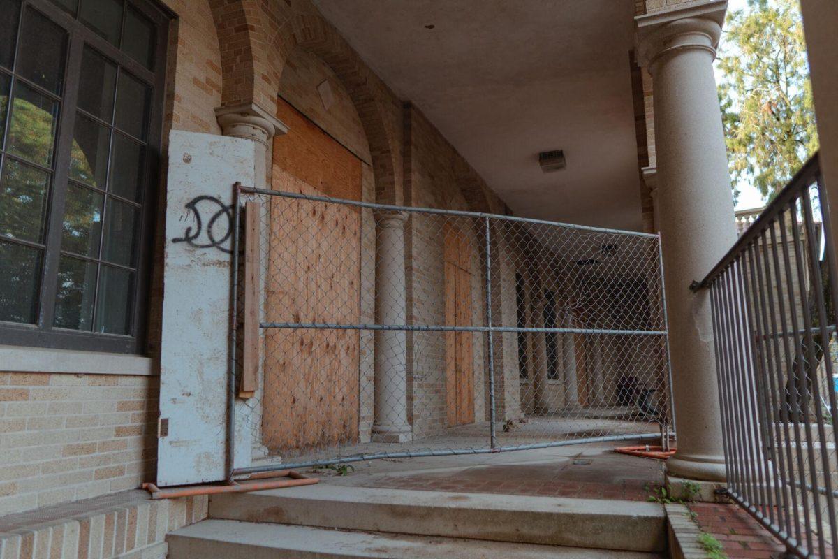 Fencing blocks the boarded-up side entrances on Tuesday, March 22, 2022, of the Huey P. Long Field House on Field House Drive in Baton Rouge, La.