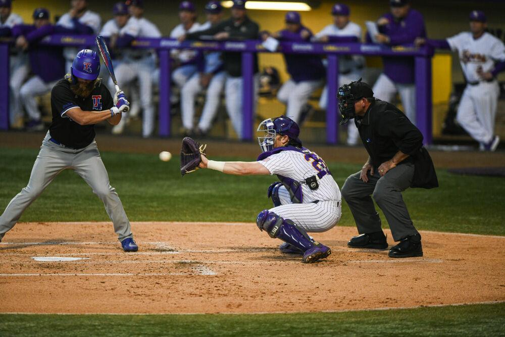 LSU baseball graduate student catcher Tyler McManus (26) catches a strike Wednesday, March. 23, 2022 during LSU's 6-7 loss against Louisiana Tech at Alex Box Stadium on Gourrier Avenue in Baton Rouge, La.