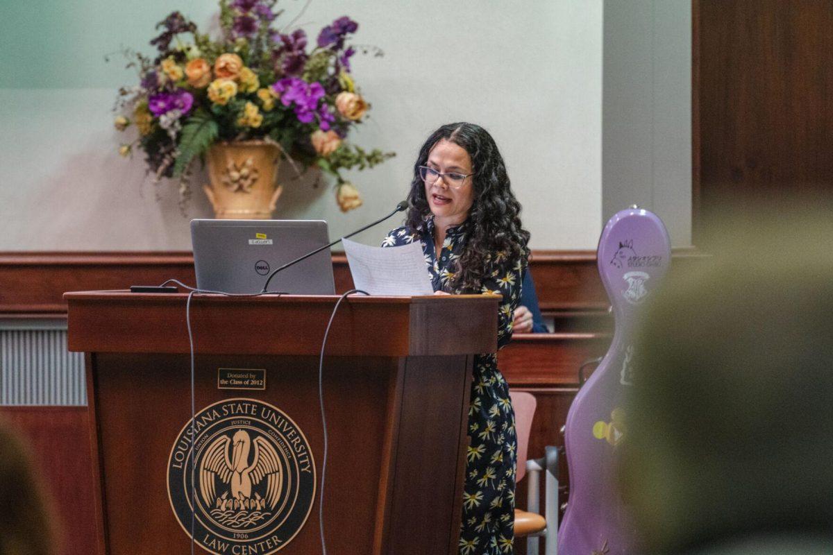 LSU Faculty Senate Member-at-Large Inessa Bazayev reads out a resolution on Thursday, March 24, 2022, inside the LSU Law Center on Highland Road in Baton Rouge, La.