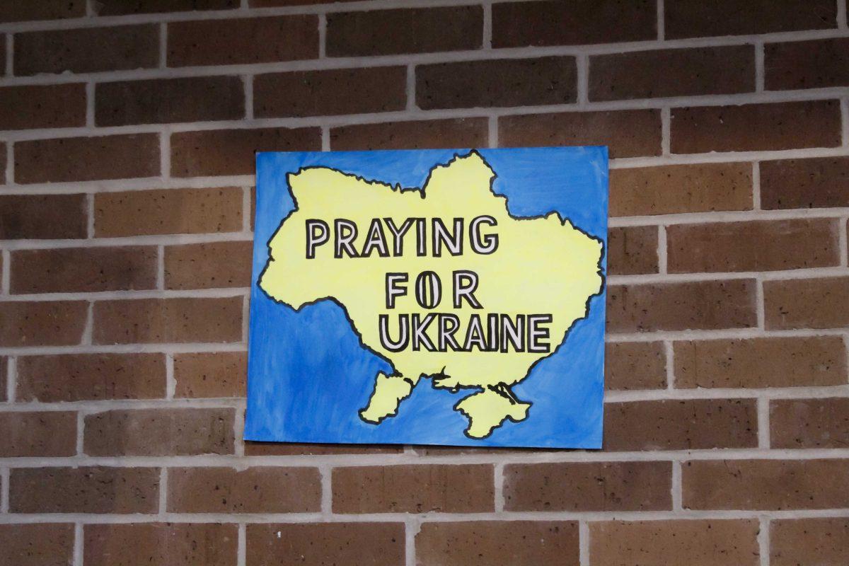 A sign that reads "Praying for Ukraine" sits on the wall Friday, March 4, 2022 at the for the Ukraine supoort event at the LSU International Cultural Center on Dalrymple Drive in Baton Rouge, La.