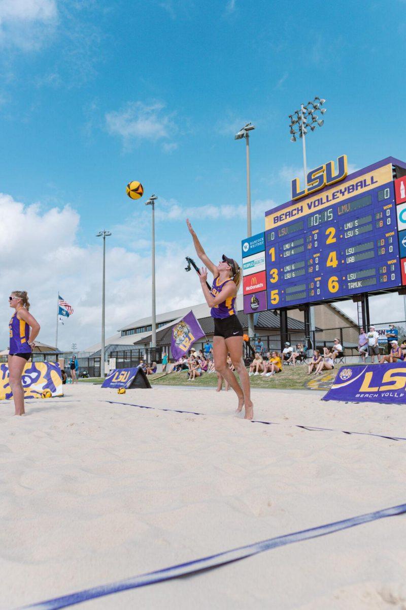 LSU beach volleyball redshirt sophomore Sierra Caffo (35) serves on Sunday, March 6, 2022, during LSU&#8217;s 3-2 win over Loyola Marymount at the Beach Volleyball Stadium on Cypress Drive in Baton Rouge, La.