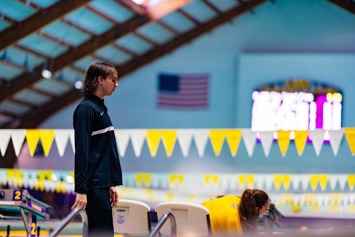 LSU swim junior Brooks Curry walks through the natatorium Saturday, Oct. 9, 2021 during LSU men's 194-106 win over GCU at the LSU Natatorium in Baton Rouge, La.