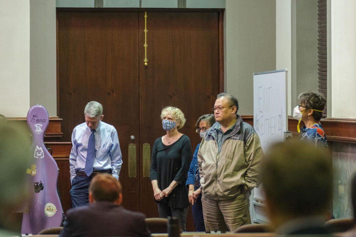 Co-sponsors of a Faculty Senate resolution stand in the front of the room on Thursday, March 24, 2022, as the resolution is read aloud inside the LSU Law Center on Highland Road in Baton Rouge, La.