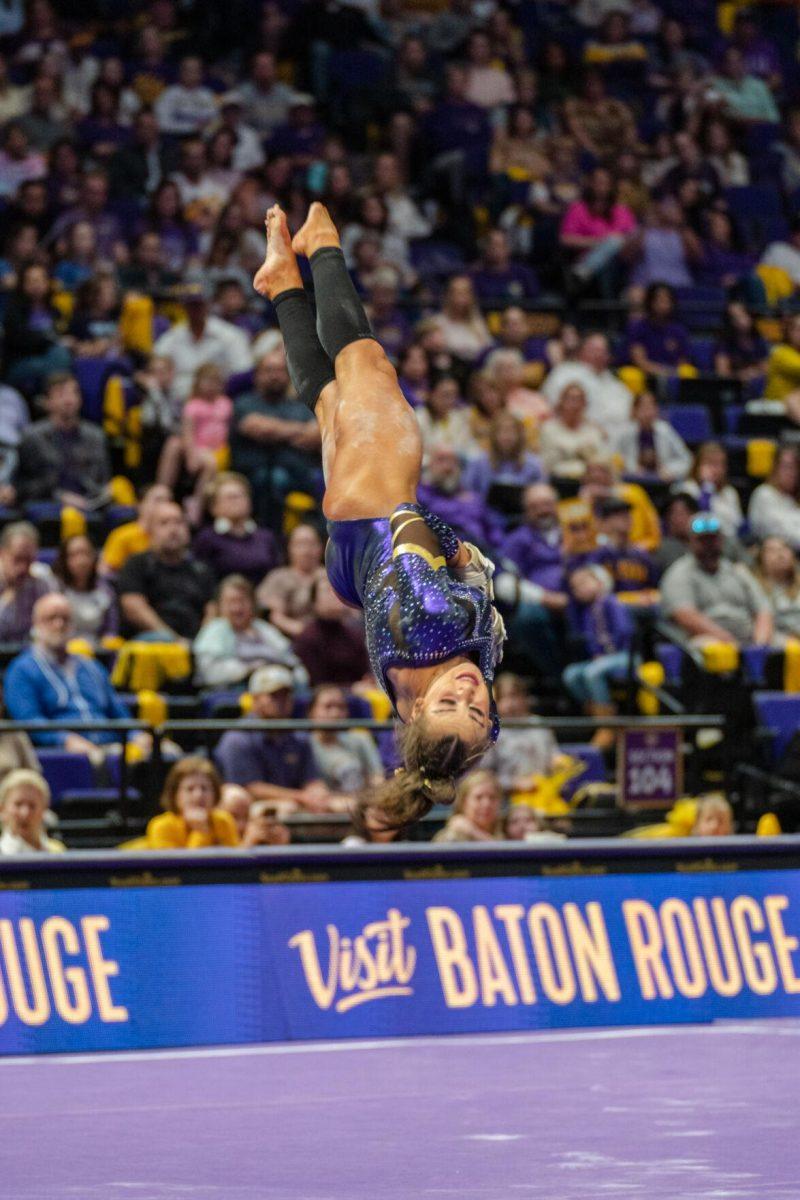 LSU gymnastics all-around freshman KJ Johnson spins through the air on Friday, March 4, 2022, during LSU gymnastics&#8217; 107.500-197.450 loss against Kentucky in the Pete Maravich Assembly Center on North Stadium Drive in Baton Rouge, La.