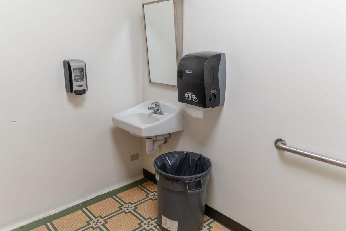 A garbage can sits under the paper towel dispenser on Tuesday, March 29, 2022, inside an Allen Hall bathroom on LSU&#8217;s campus in Baton Rouge, La.