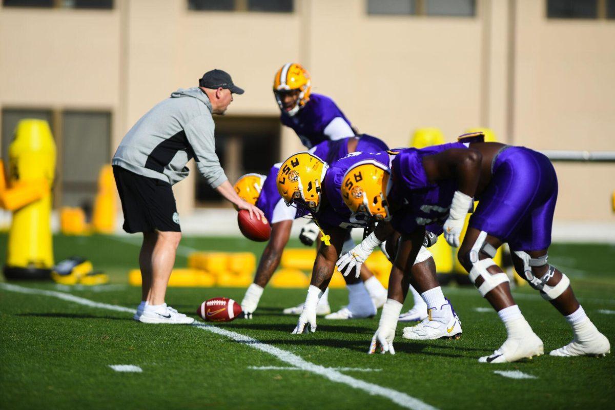 LSU football defense gets into position for a play Tuesday, March 29, 2022 during LSU's spring practice in Baton Rouge, La.