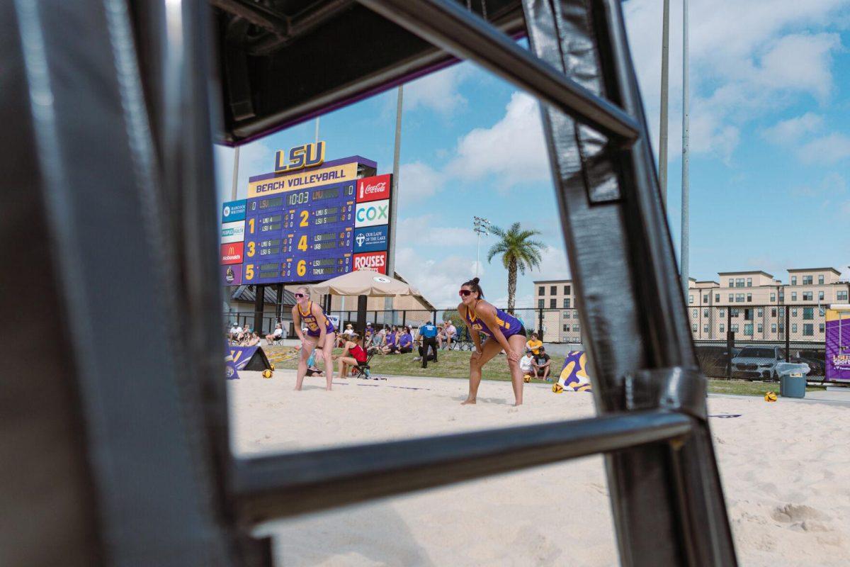 LSU beach volleyball sophomore Amber Haynes (12) and junior Elizabeth Masters (8) patiently wait for the serve on Sunday, March 6, 2022, during LSU&#8217;s 3-2 win over Loyola Marymount at the Beach Volleyball Stadium on Cypress Drive in Baton Rouge, La.