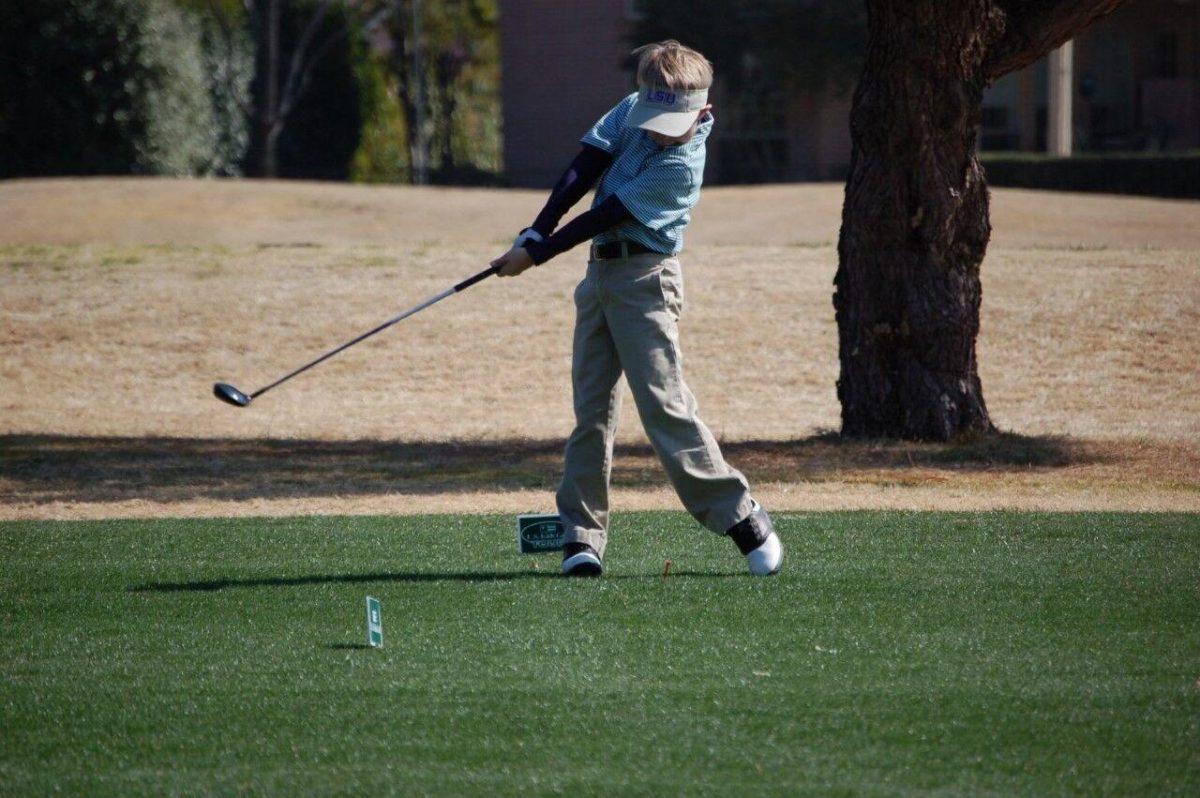 A young Hayden White tees off in a junior golf tournament at Brookhaven.&#160;