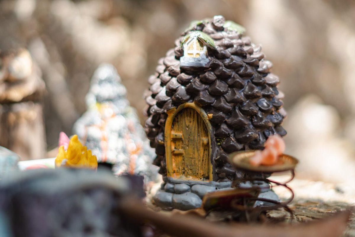 The sounds of a heated poker game come from the Pinecone Home on Thursday, March 24, 2022, in the Fairy Garden on LSU&#8217;s campus in Baton Rouge, La.