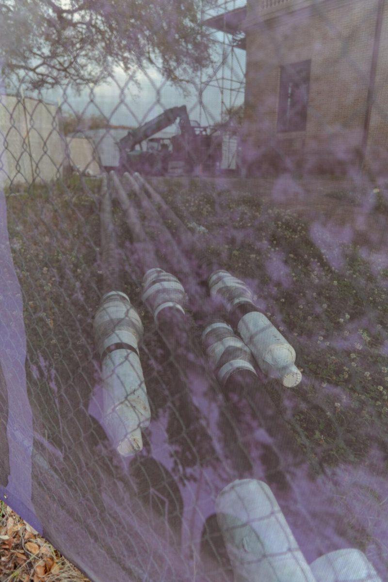 Piping appears purple through the mesh on Tuesday, March 22, 2022, at the Huey P. Long Field House on Field House Drive in Baton Rouge, La.