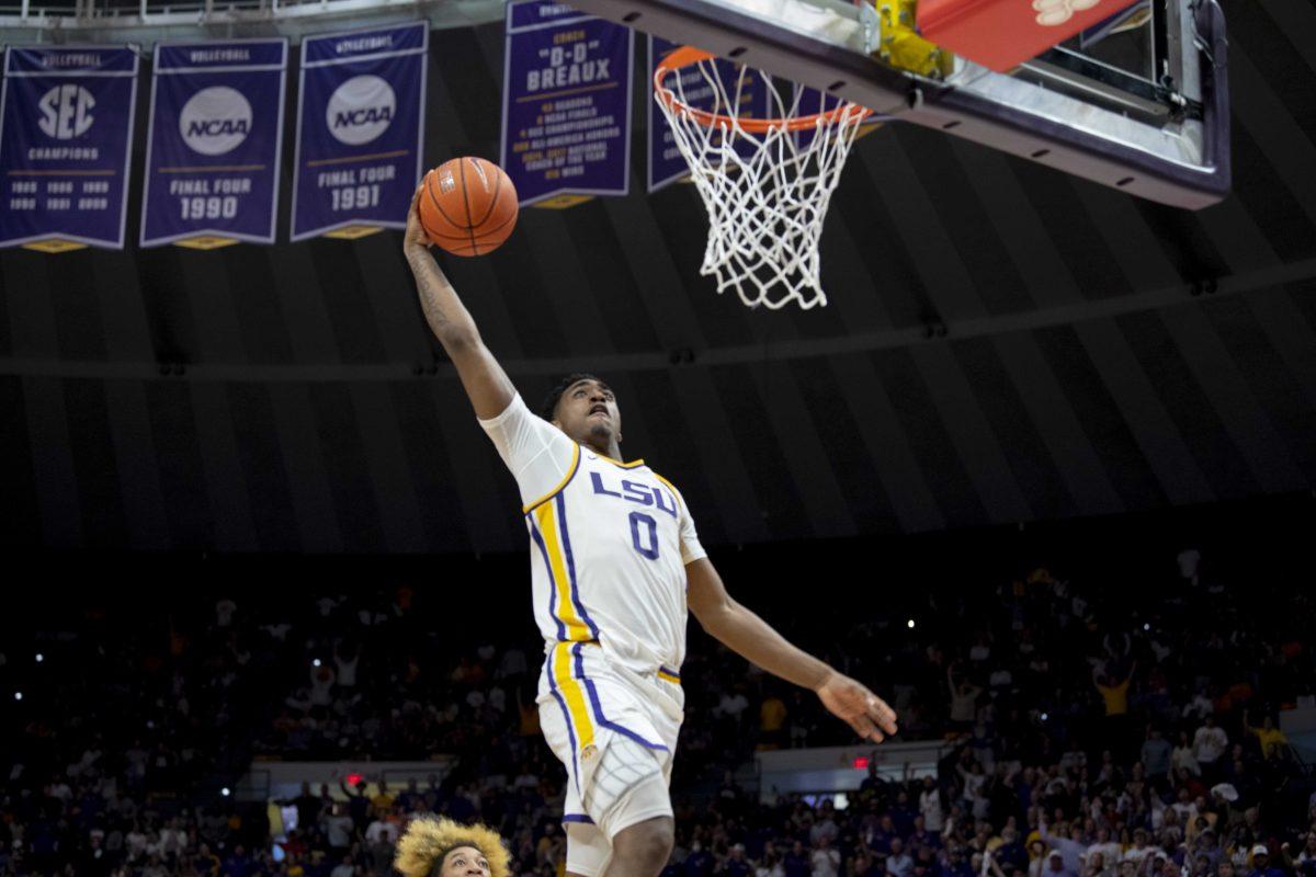 LSU men&#8217;s basketball freshman guard Brandon Murray (0) dunks the ball Saturday, March 5, 2022, during LSU&#8217;s 80-77 win against Alabama in the Pete Maravich Assembly Center on North Stadium Drive in Baton Rouge, La.