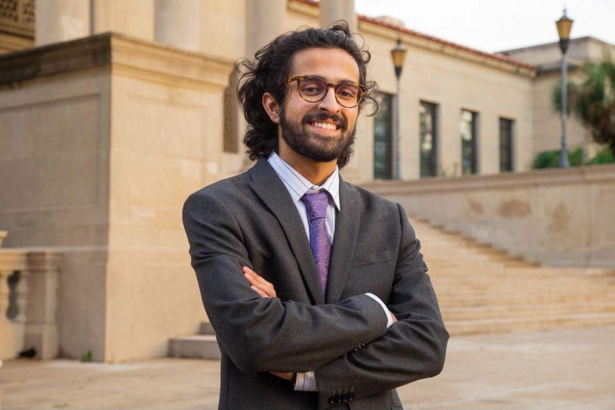 Hamood Qureshi stands in front of the LSU Law Center.