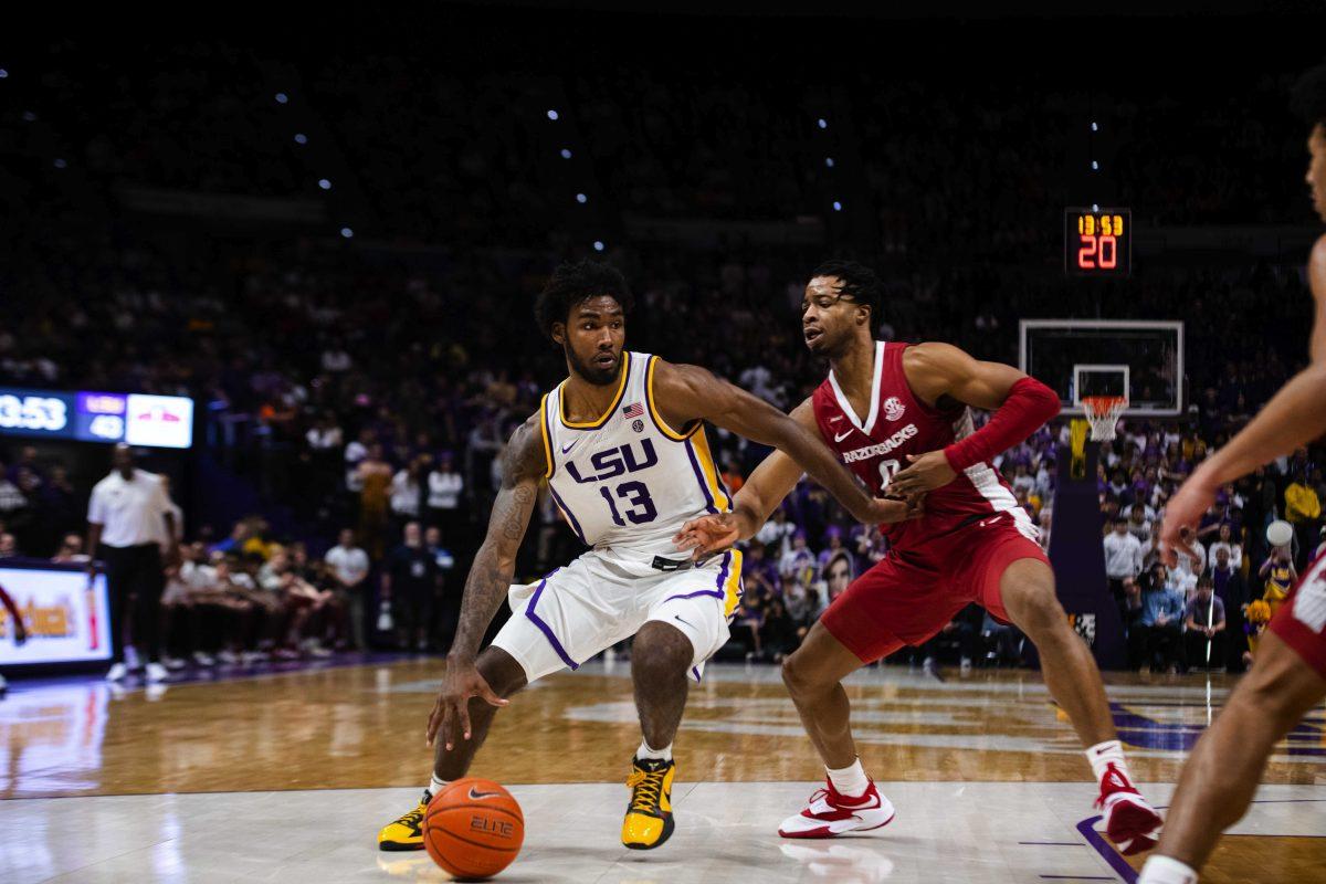 LSU men&#8217;s basketball sophomore forward Tari Eason (13) attempts to back down an Arkansas defender Jan. 15, 2022, during LSU&#8217;s 65-58 loss against Arkansas in the Pete Maravich Assembly Center on North Stadium Drive in Baton Rouge, La.