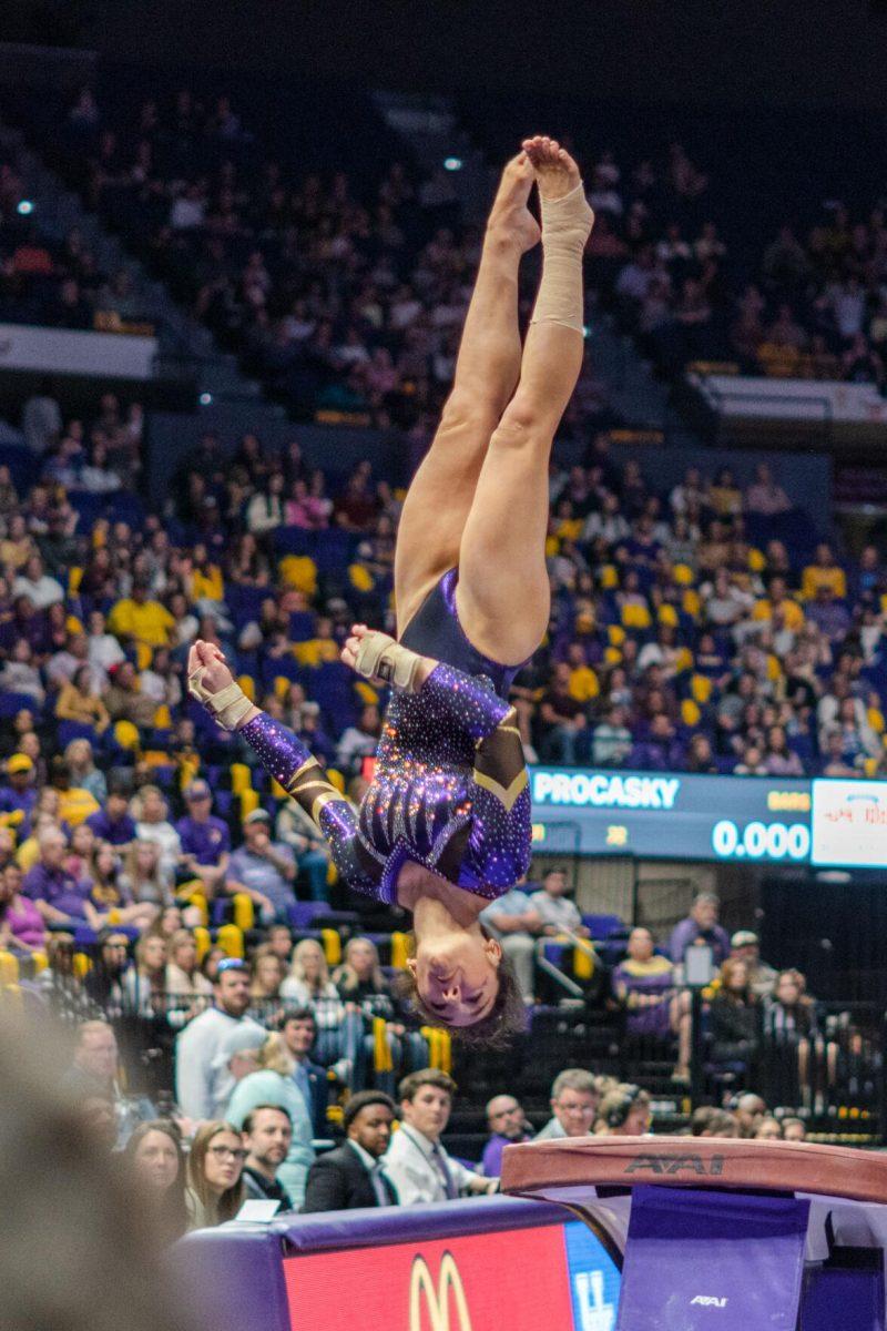 LSU gymnastics all-around sophomore Elena Arenas spins through the air on Friday, March 4, 2022, during LSU gymnastics&#8217; 107.500-197.450 loss against Kentucky in the Pete Maravich Assembly Center on North Stadium Drive in Baton Rouge, La.