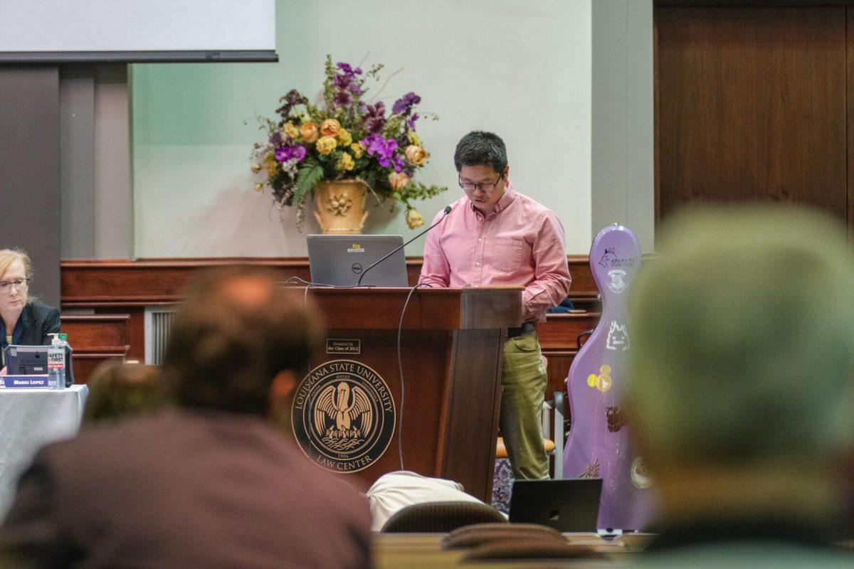 An LSU Faculty Senator reads out a resolution on Thursday, March 24, 2022, inside the LSU Law Center on Highland Road in Baton Rouge, La.