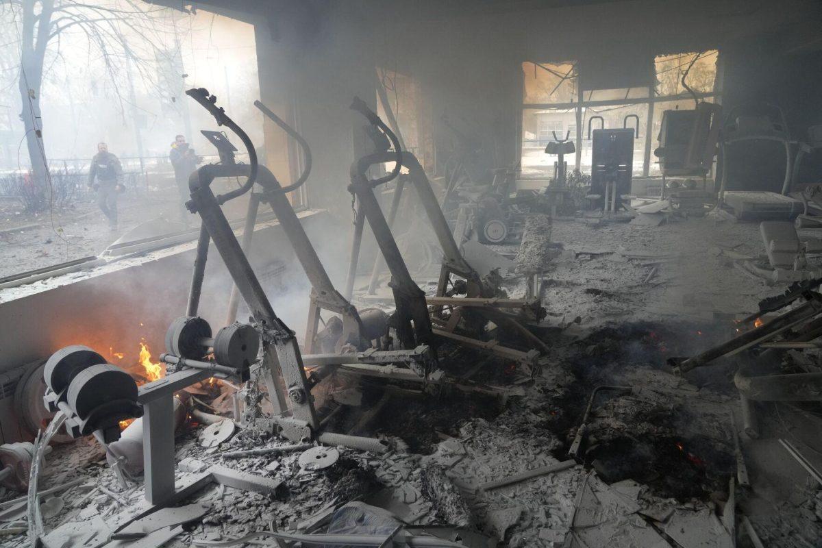 A view of smoke from inside a damaged gym following shelling in Kyiv, Ukraine, Wednesday, March 2, 2022. Russian forces have escalated their attacks on crowded cities in what Ukraine's leader called a blatant campaign of terror. (AP Photo/Efrem Lukatsky)