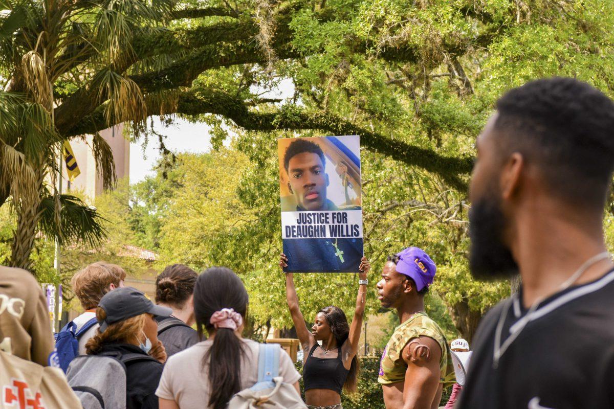 Rally members hold up a poster saying &#8220;Justice for Deaughn Willis&#8221; Wednesday, April 6, 2022, in Free Speech Plaza in Baton Rouge, Louisiana.