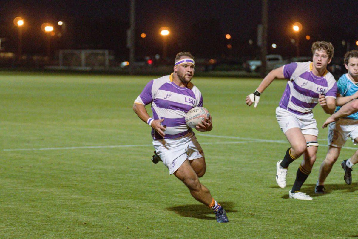 LSU Rugby flanker Hunter McCraine runs down the pitch on Friday, April 8, 2022, during LSU&#8217;s 89-0 win over Tulane at the UREC Fields on Gourrier Avenue in Baton Rouge, La.