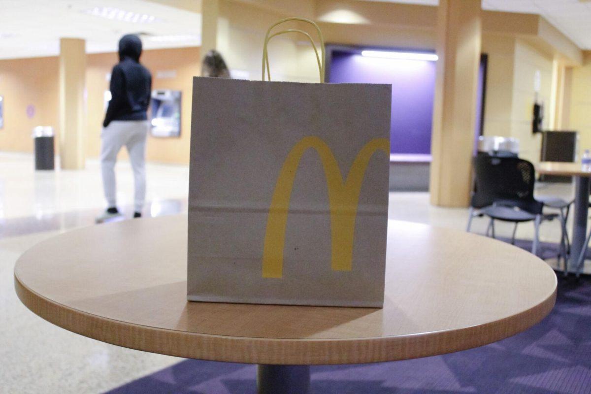 A brown paper McDonald's bag sits on the table in the diining area on Friday, April 8, 2022, at the LSU Student Union in Baton Rouge, La.