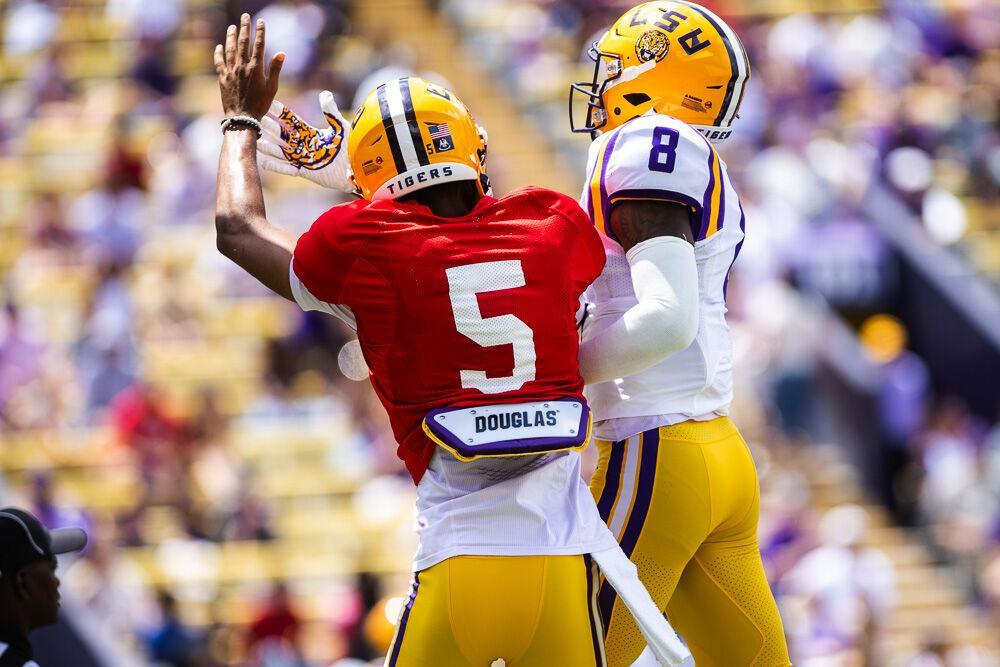 LSU football junior quarterback Jayden Daniels (5) rushes into the end zone and celebrates with sophomore wide receiver Malik Nabers (8) Saturday, April 23, 2022, during LSU football&#8217;s annual spring football game with White winning 51-31 over Purple in Tiger Stadium.