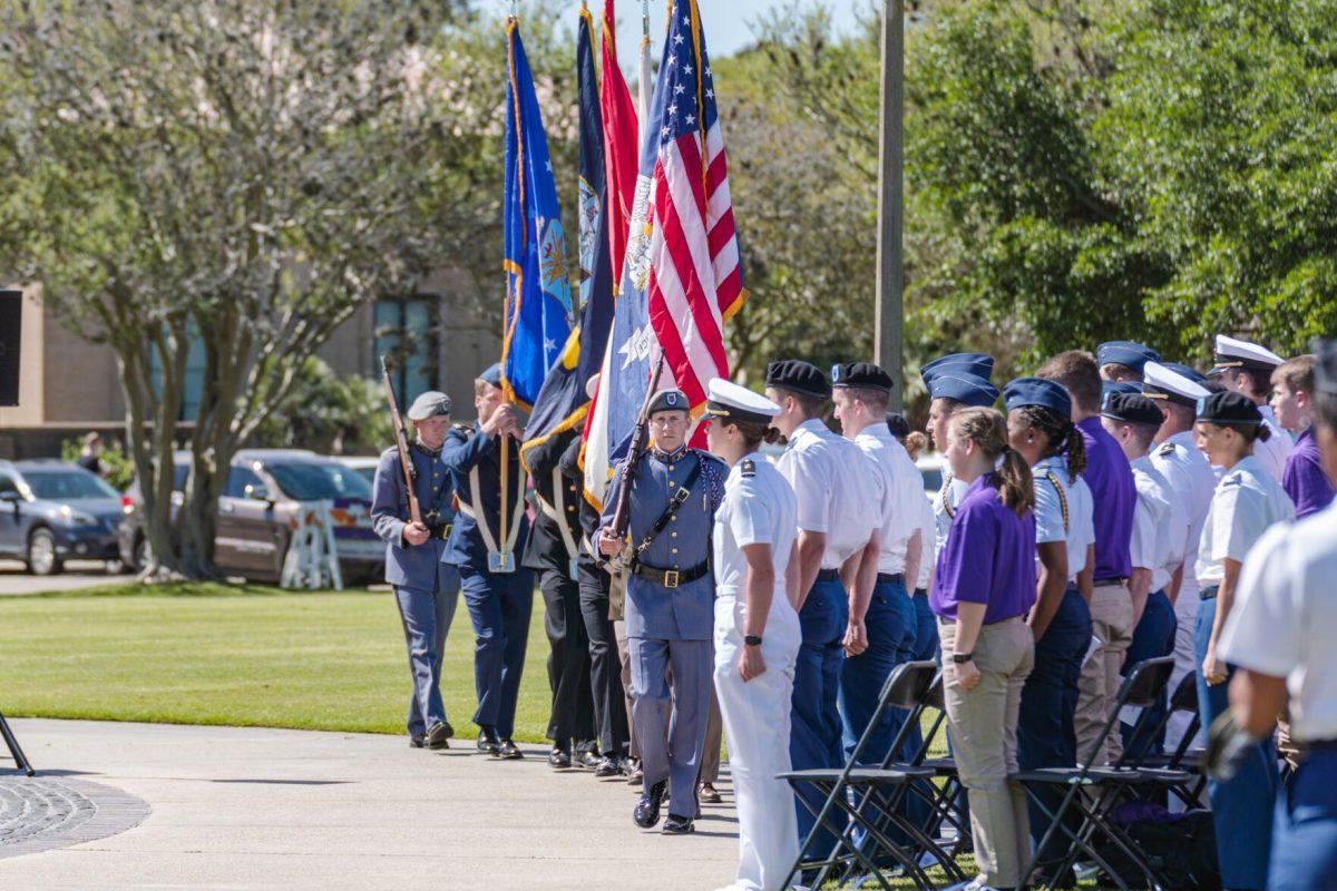 The color guard presents the colors on Thursday, April 7, 2022, as the change of command ceremony begins on the LSU Parade Ground on Highland Road in Baton Rouge, La.