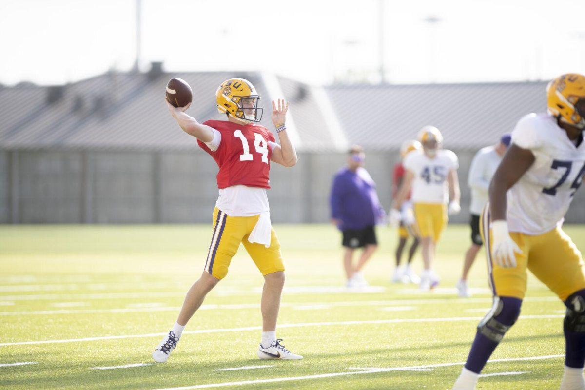 LSU football quarterback Walker Howard (14) prepares to pass the ball Thursday, April 21, 2022, during LSU&#8217;s spring practice in Baton Rouge, Louisiana.