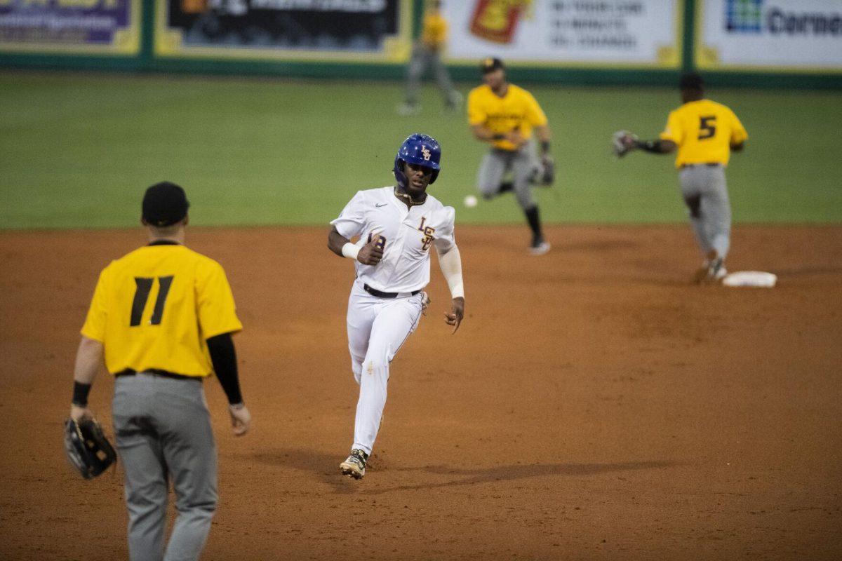 LSU baseball sophomore first base Tre&#8217; Morgan (18) dashes to third base Thursday, April 21, 2022, during the game against the University of Missouri at Alex Box Stadium on Gourrier Avenue in Baton Rouge, Louisiana.