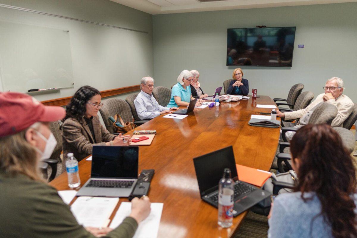 The LSU Faculty Senate Executive Committee sits around the table on Wednesday, April 20, 2022 inside the LSU Student Union on Highland Road in Baton Rouge, La.