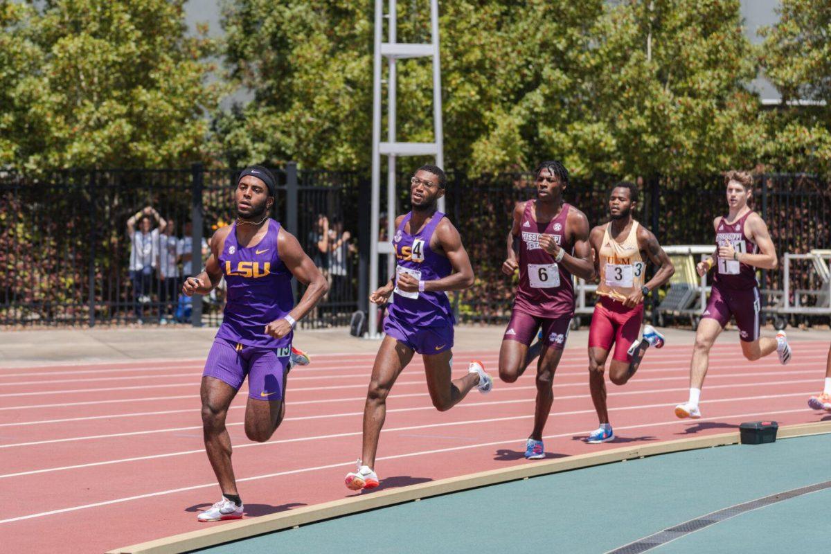 LSU track and field distance sophomore Isiah Travis and distance graduate student Eric Coston round the bend on Saturday, April 2, 2022, during the 1500m run at the Battle on the Bayou track meet at Bernie Moore Stadium in Baton Rouge, La.