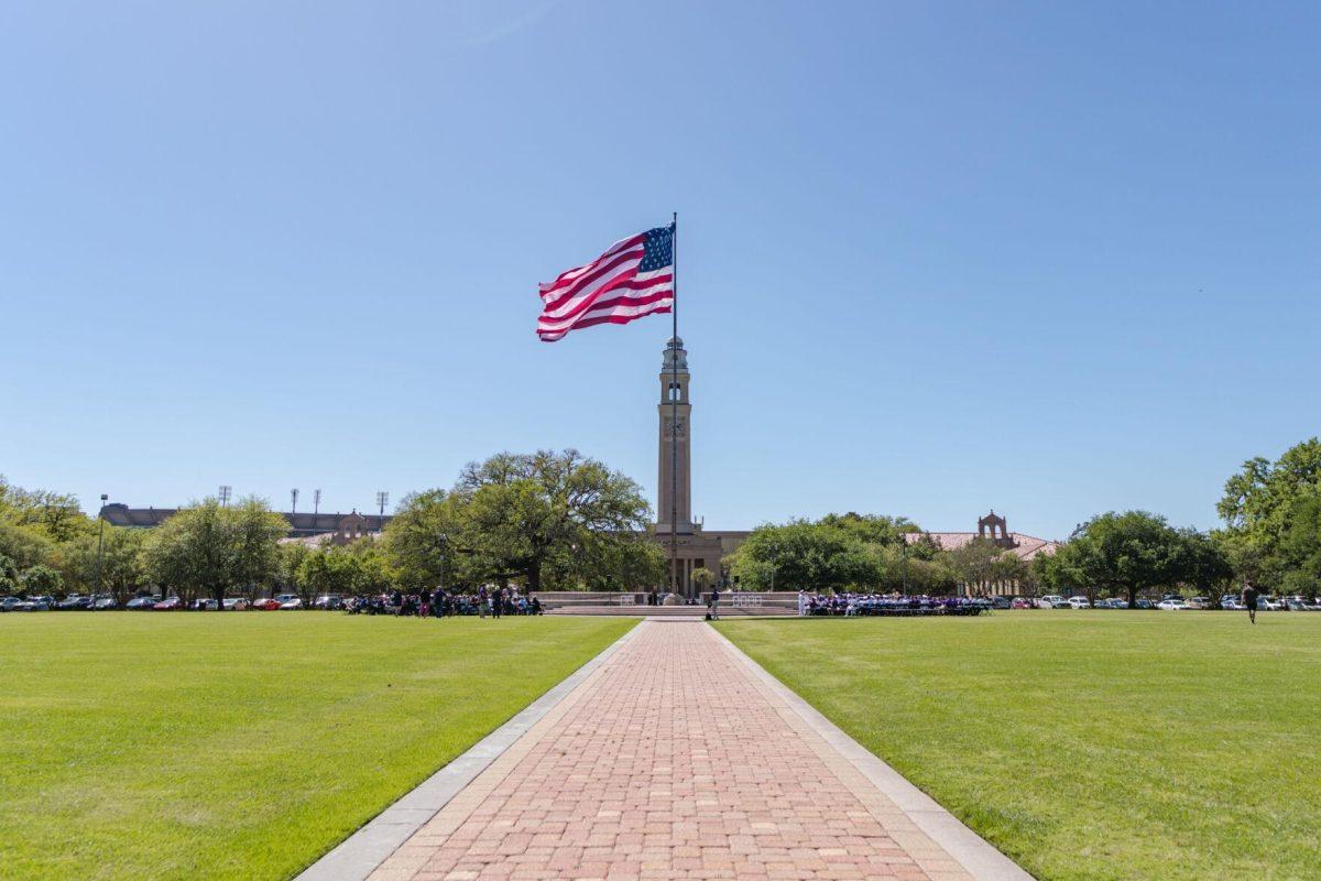 The American flag waves in the wind on Thursday, April 7, 2022, as the change of command ceremony begins on the LSU Parade Ground on Highland Road in Baton Rouge, La.