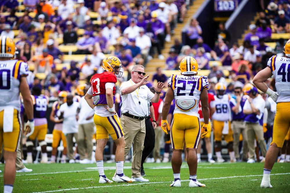 LSU football head coach Brian Kelly works with the offense before the next play Saturday, April 23, 2022, during LSU football&#8217;s annual spring football game with White winning 51-31 over Purple in Tiger Stadium.