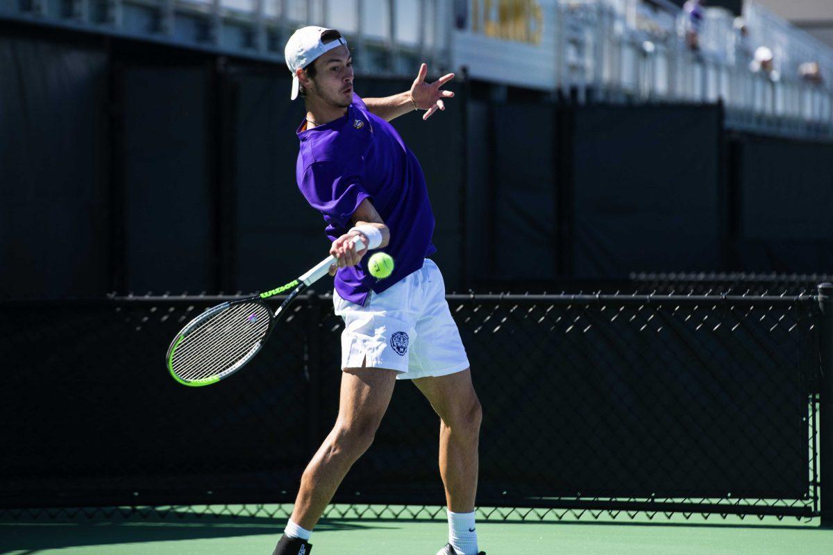 LSU men's tennis sophomore Benjamin Ambrosio prepares to hit the ball Sunday, Feb. 13, 2021 during LSU's 6-1 win over Purdue at the LSU Tennis Complex on Gourrier Avenue in Baton Rouge, La.