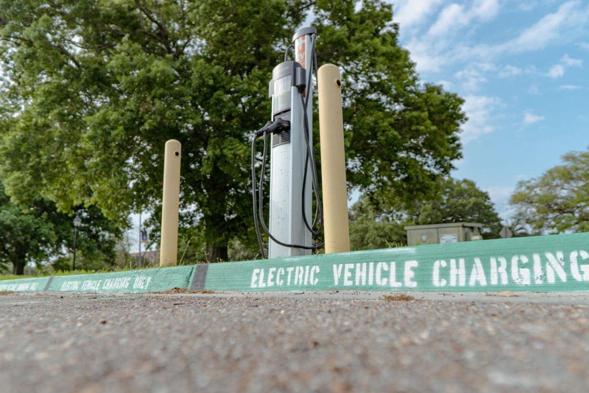 Writing denotes the electric vehicle charging parking spaces on Sunday, April 17, 2022, in the South Quad Drive parking lot in Baton Rouge, La.