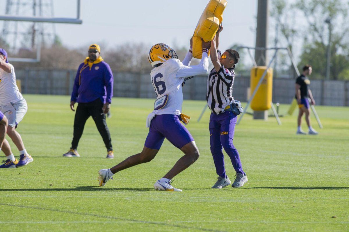 LSU football cornerback Quad Wilson (16) runs a drill Thursday, April 7, 2022, during LSU&#8217;s spring practice in Baton Rouge, Louisiana.