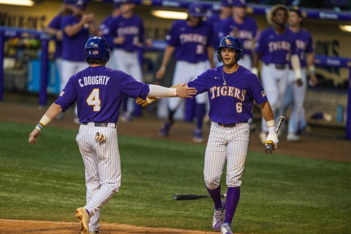 LSU baseball redshirt sophomore infield Cade Doughty (4) high fives redshirt sophomore outfield/ first base Brayden Jobert Tuesday, April 19, 2022, against University of Louisiana Lafayette at Alex Box Stadium on Gourrier Avenue in Baton Rouge, La.