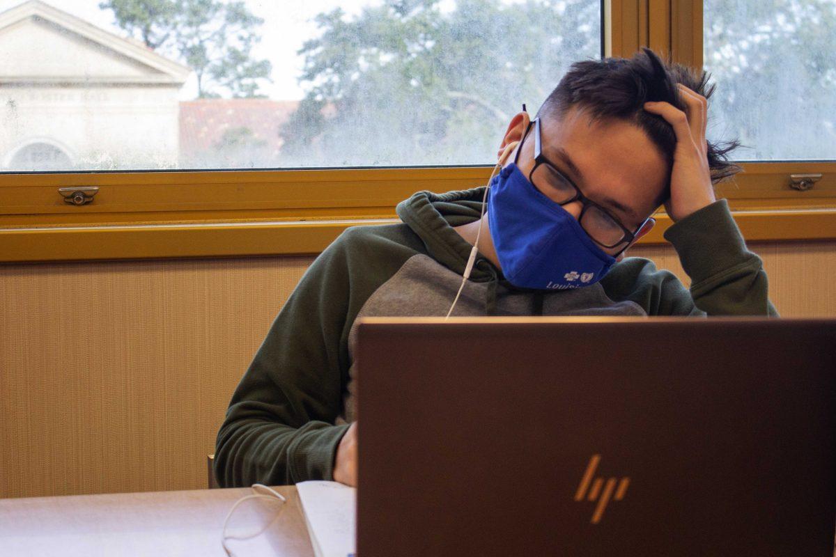 LSU history junior Francis Doan attends a zoom class Jan. 19, 2022, in the LSU Library.