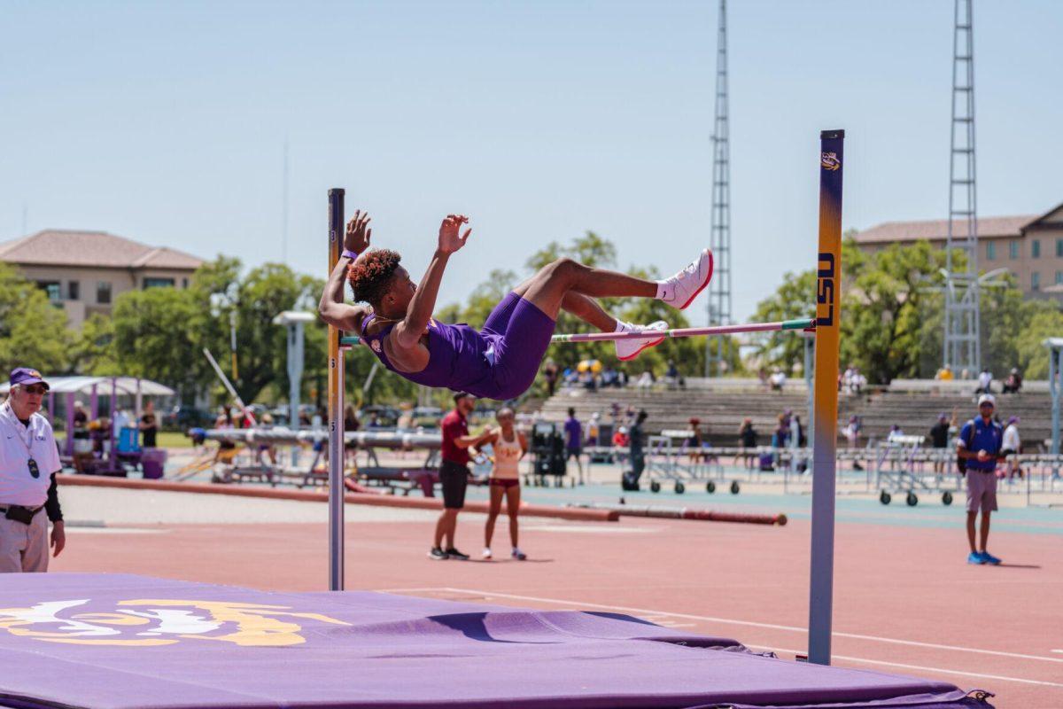 LSU track and field sophomore Ronnie Rounds II clears the bar on Saturday, April 2, 2022, during the high jump event at the Battle on the Bayou track meet at Bernie Moore Stadium in Baton Rouge, La.