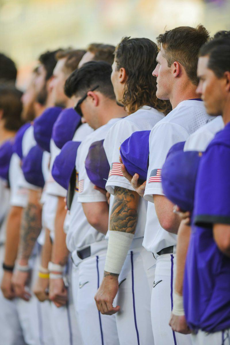 The LSU baseball team stands for the national anthem Tuesday, March 29, 2022 before LSU's 15-4 win against ULM at Alex Box Stadium on Gourrier Avenue in Baton Rouge, La.