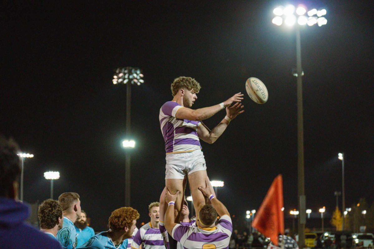 LSU Rugby number 8 Jamie Kennedy tosses the ball to a teammate on Friday, April 8, 2022, during LSU&#8217;s 89-0 win over Tulane at the UREC Fields on Gourrier Avenue in Baton Rouge, La.