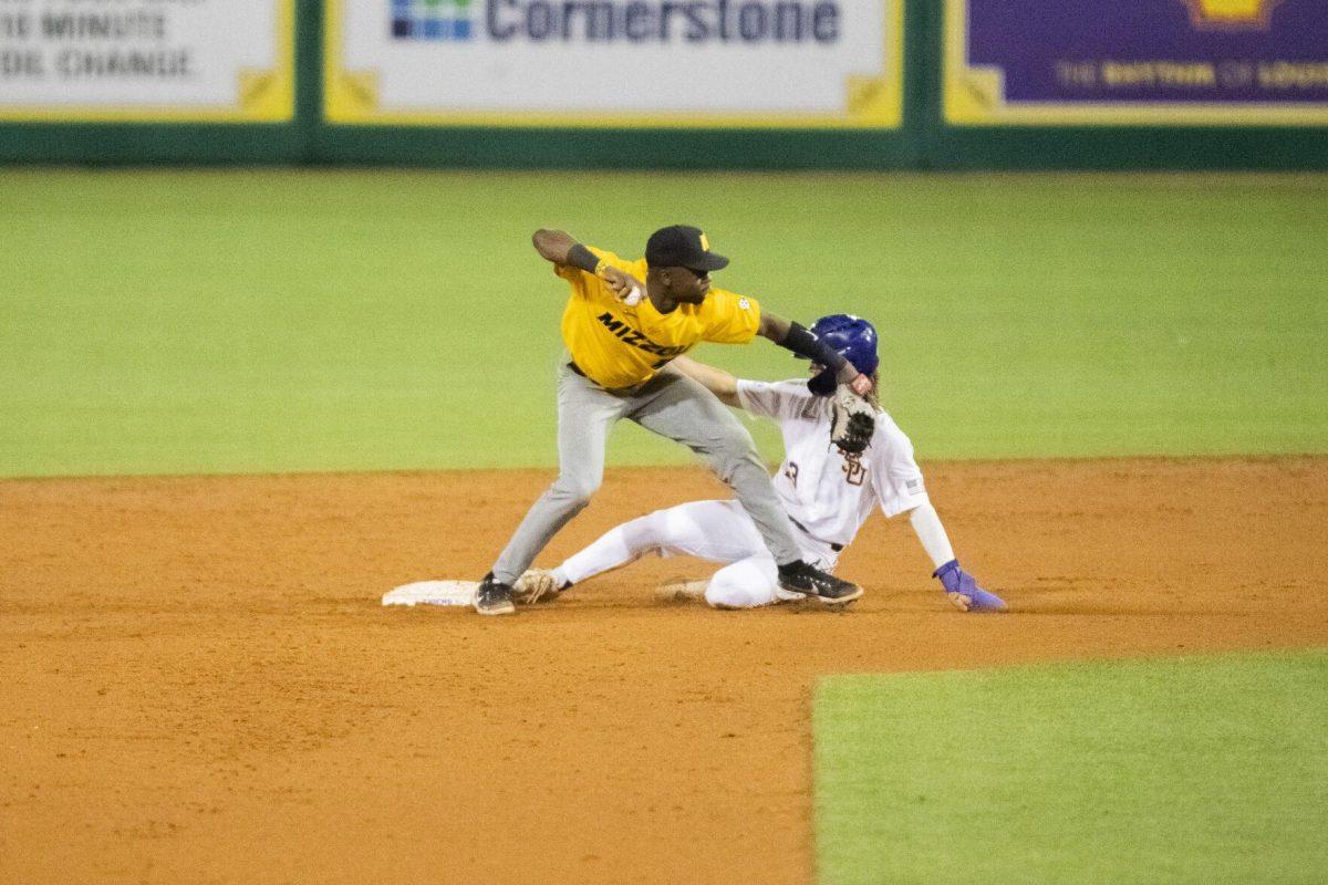 LSU baseball sophomore infield Jordan Thompson (13) slides to second base Thursday, April 21, 2022, during the game against the University of Missouri at Alex Box Stadium on Gourrier Avenue in Baton Rouge, Louisiana.