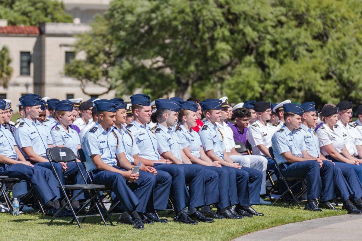 Members of the LSU ROTC listen to President Tate on Thursday, April 7, 2022, at the change of command ceremony on the LSU Parade Ground on Highland Road in Baton Rouge, La.