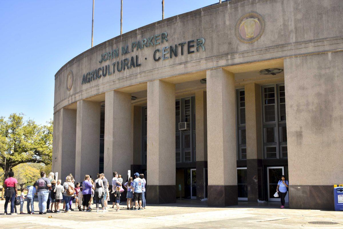 People line up outside of the John M. Parker Agricultural Coliseum Friday, April 1, 2022, on LSU Avenue in Baton Rouge, Louisiana.