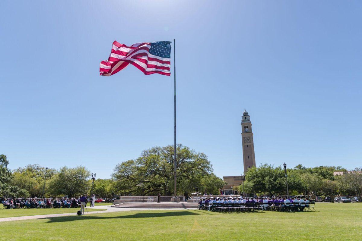 The American flag waves in the wind on Thursday, April 7, 2022, as the change of command ceremony begins on the LSU Parade Ground on Highland Road in Baton Rouge, La.