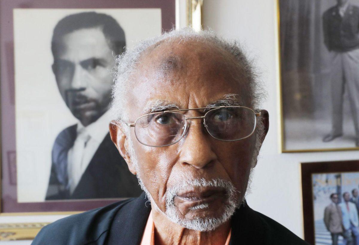 FILE - World War II veteran Johnnie Jones, Sr. poses for a portrait at his home in Baton Rouge, La., May 28, 2019. His goddaughter, Mada McDonald, tells WAFB-TV that Jones died on Saturday, April, 23, 2022, at a veterans' home in Jackson, La. (AP Photo/Gerald Herbert, File)