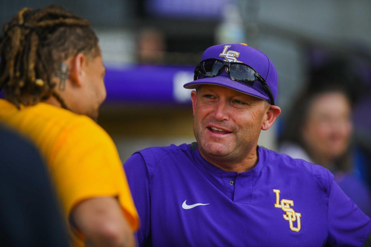 Former LSU football safety and Super Bowl Champion Tyrann Mathieu talks to LSU baseball head coach Jay Johnson Tuesday, March 29, 2022 before LSU's 15-4 win against ULM at Alex Box Stadium on Gourrier Avenue in Baton Rouge, La.