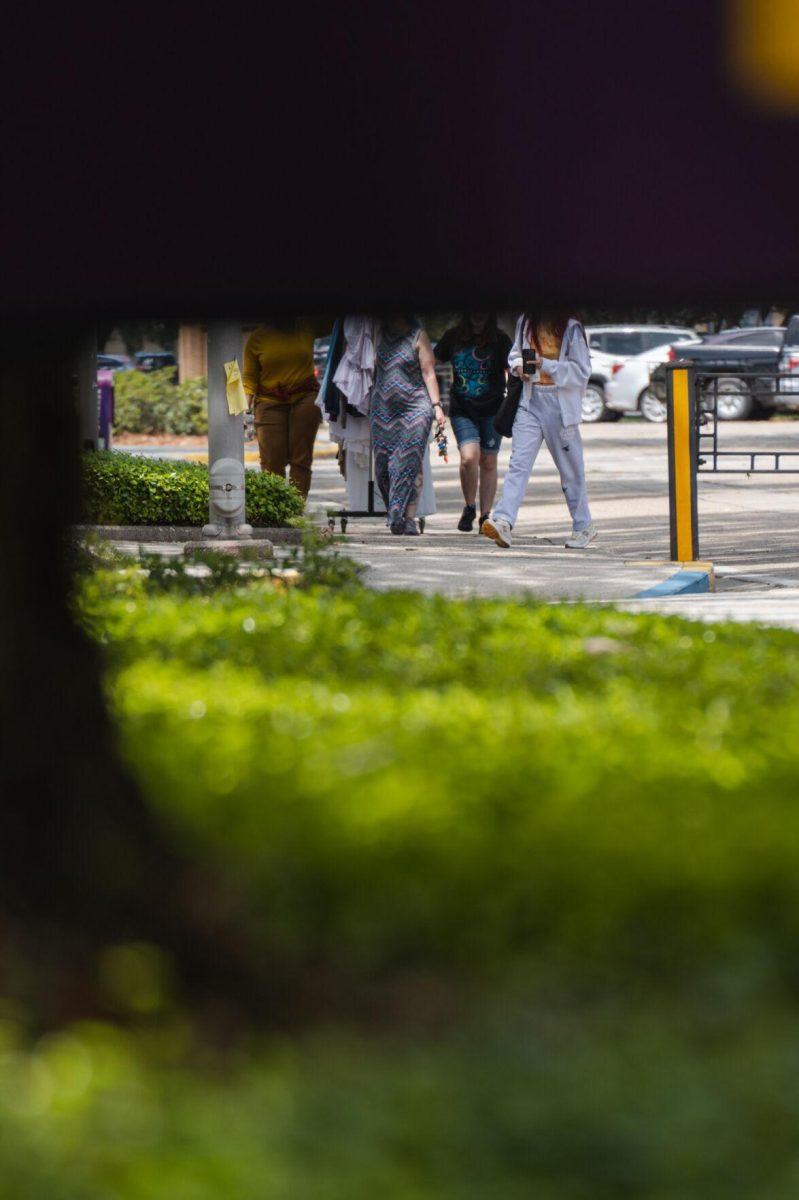 A sign conceals the heads of many on Tuesday, April 19, 2022, near Nicholson Hall on Tower Drive in Baton Rouge, La.