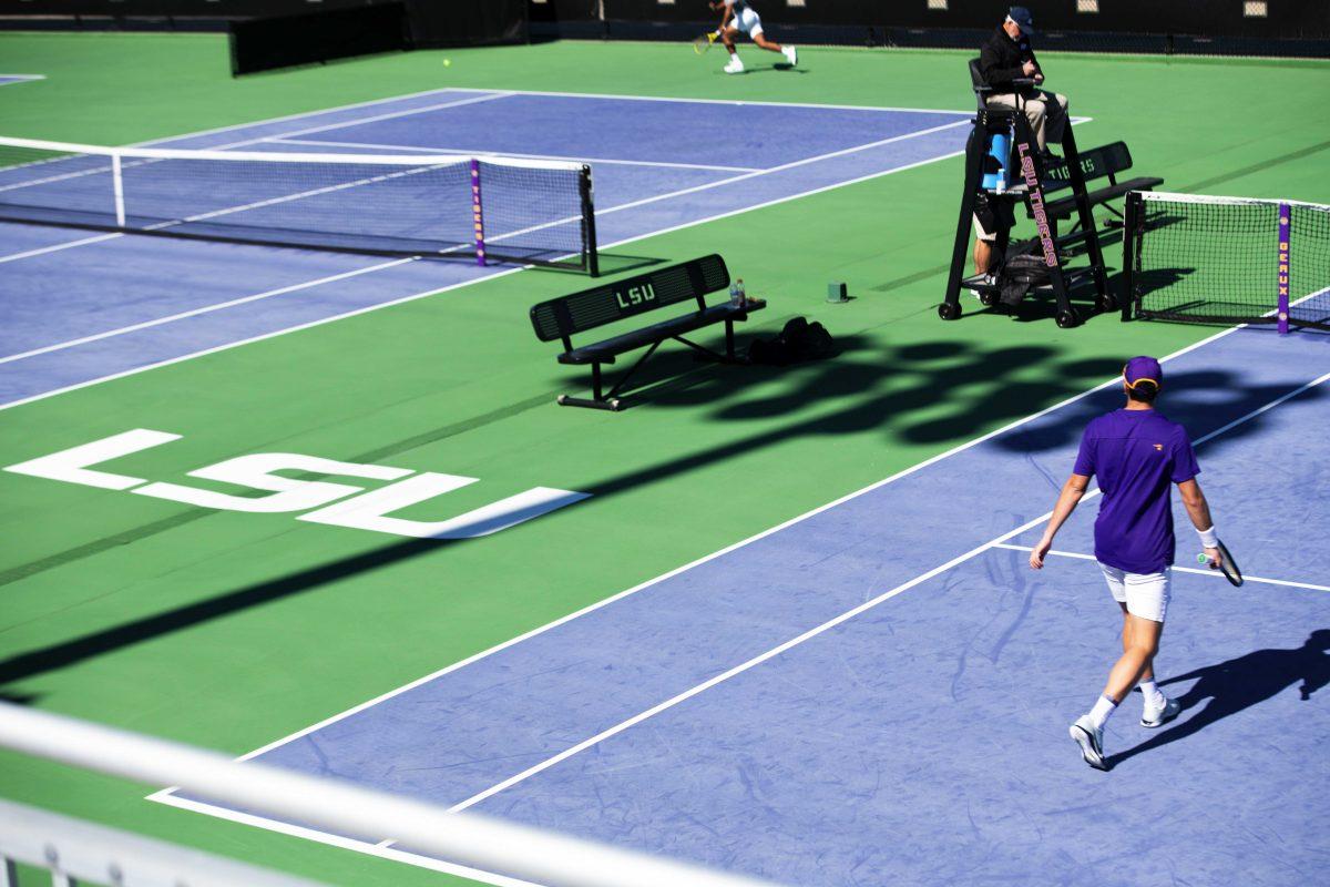 LSU men's tennis graduate student Gabriel Diaz Freire walks towards the net Sunday, Feb. 13, 2021 during LSU's 6-1 win over Purdue at the LSU Tennis Complex on Gourrier Avenue in Baton Rouge, La.