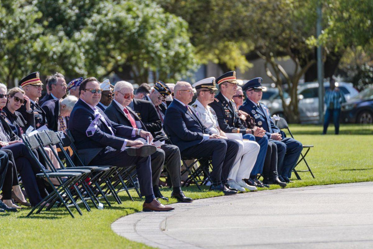 Guests watch the proceedings on Thursday, April 7, 2022, at the change of command ceremony on the LSU Parade Ground on Highland Road in Baton Rouge, La.