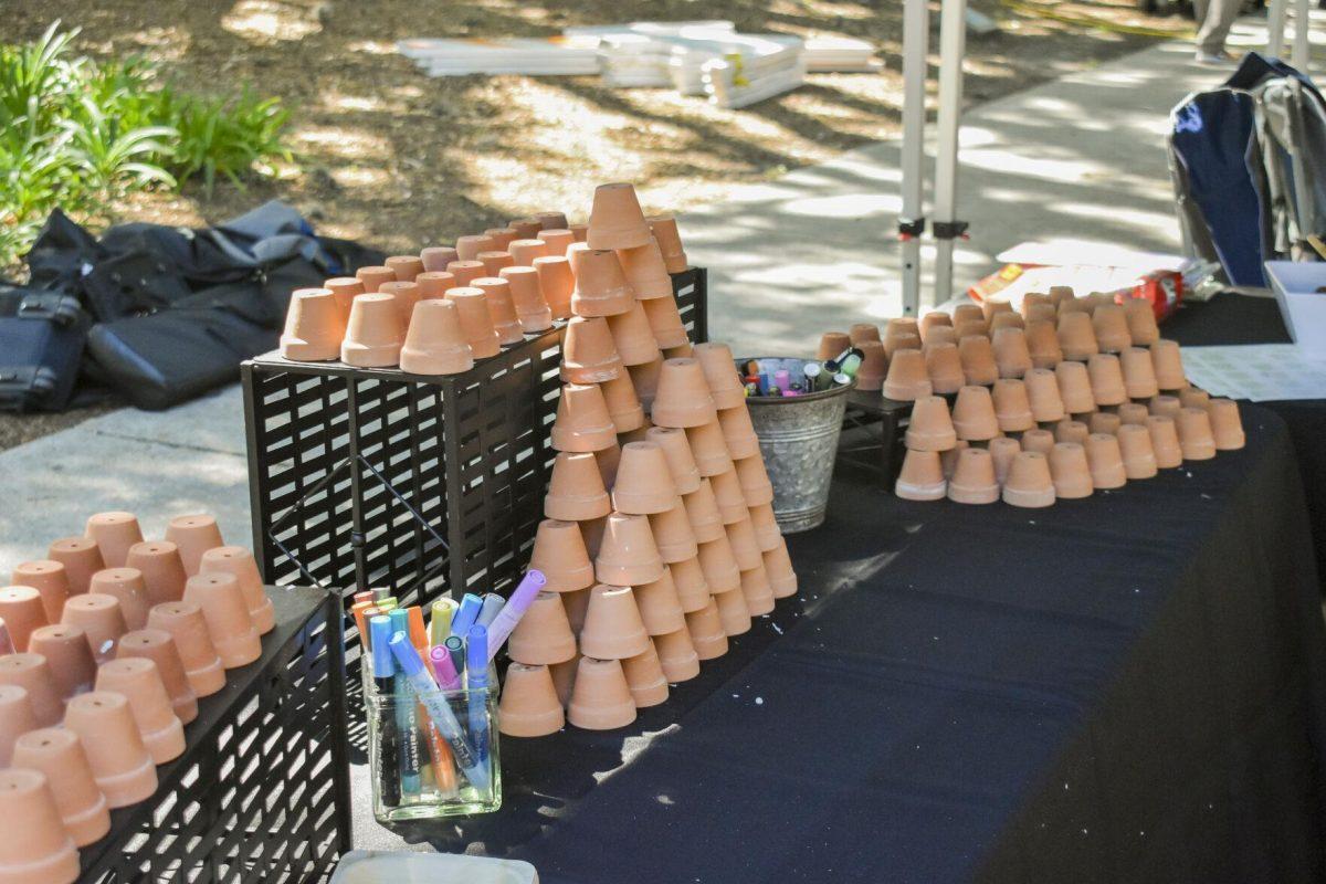 Multiple tiny plant pots sit on a table to be decorated Wednesday, April 27, 2022, during the Grateful for Spring event on Tower Drive in Baton Rouge, Louisiana.